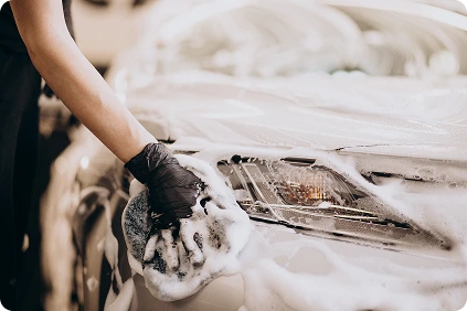 Pressure washing a white car